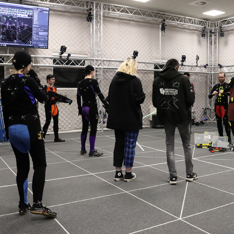 A number of people in a motion capture studio